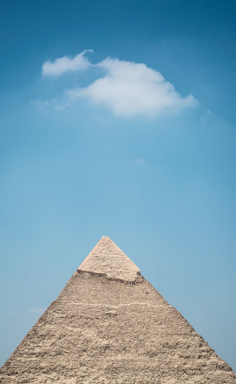 a large pyramid the under blue sky